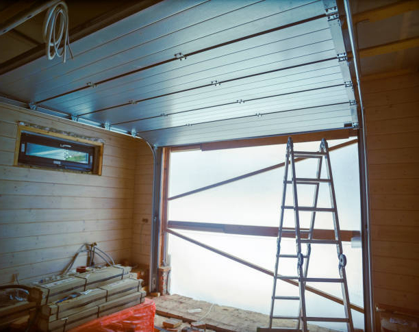 Maintenance of steel roller garage door, contra light indoor shot